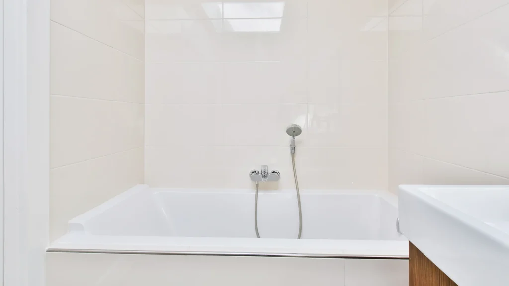 Clean glossy white refinished bathtub after professional reglazing